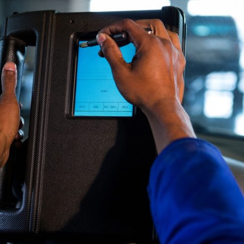 mechanic-using-touchscreen-device_light